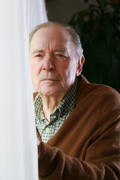 Senior male by window — Stock Photo, Image