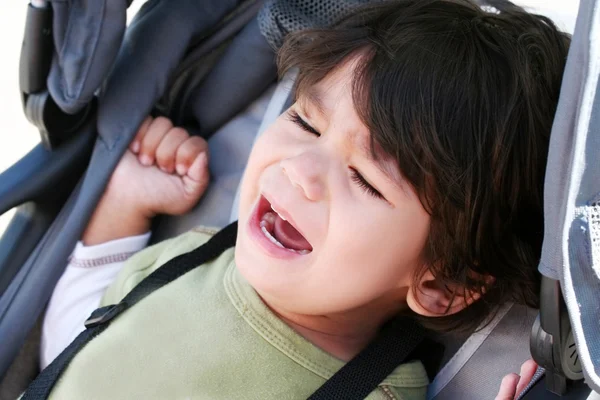 Toddler crying in stroller — Stock Photo, Image