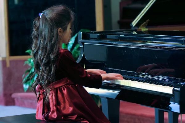 stock image Child playing piano