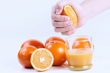 Fresh hand squeezed orange juice. Isolated on wh clipart