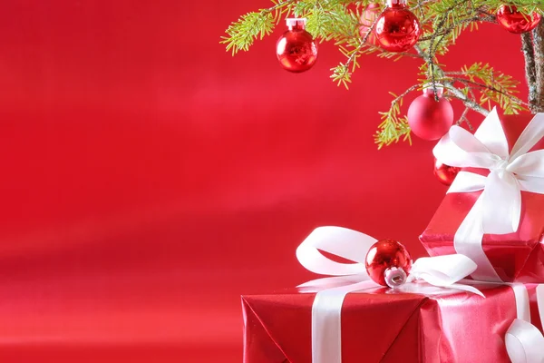 stock image Elegant red presents under Christmas tree