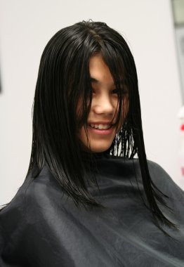 Young teen girl getting haircut clipart