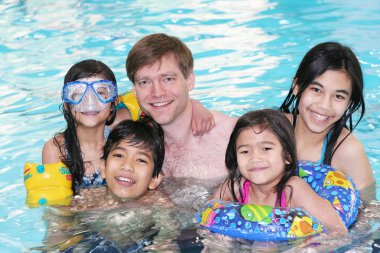 Family swimming in pool clipart