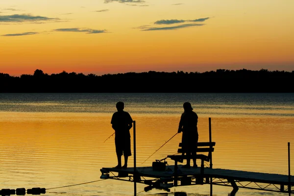 Silhouette of children fishing — Stock Photo, Image