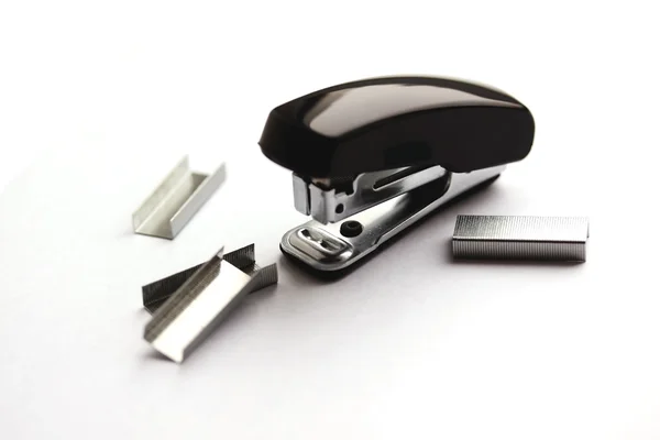 Stock image Black stapler and clips