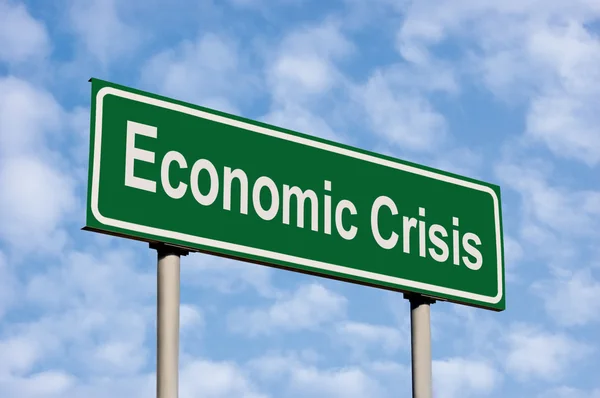 stock image Economic Crisis Green Road Sign Against Light Cloudscape Sky