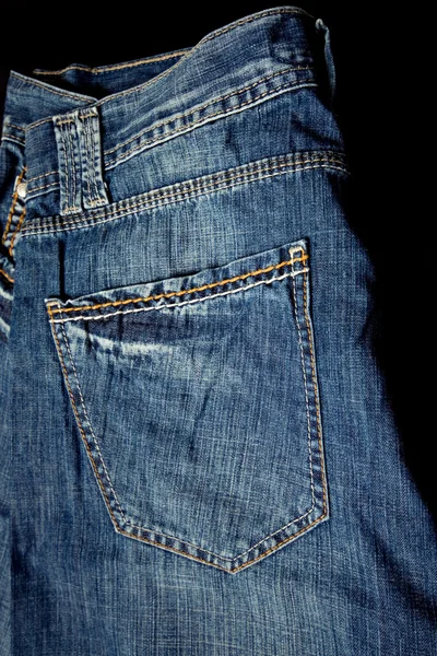 Jeans casual tyg byxor isolerad på svart bakgrund — Stockfoto