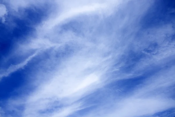 Blue cloudy sky at sunny bright day — Stock Photo, Image