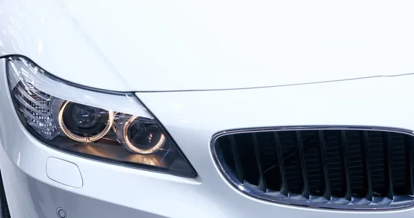 Headlights of new white car — Stock Photo, Image