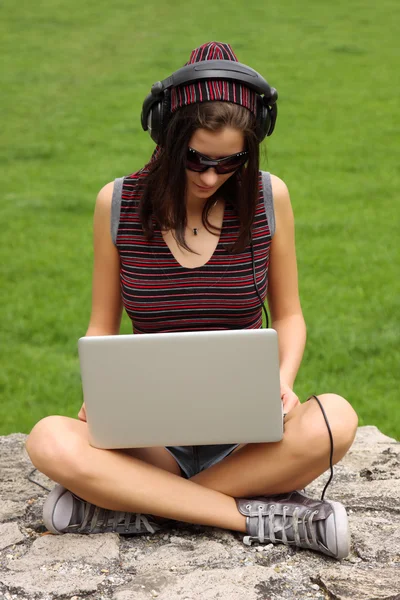 Casual teenager using her notebook — Stock Photo, Image
