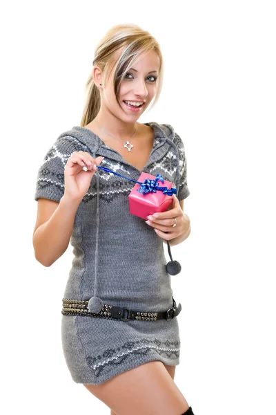 Woman opening a small pink present — Stock Photo, Image