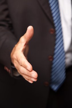 Businessman Hand Out for a Handshake clipart