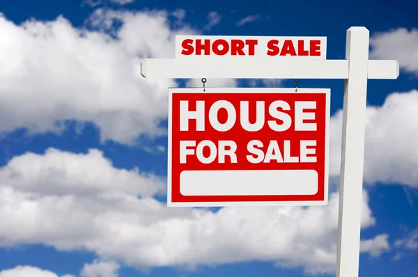 Short Sale Real Estate Sign on Clouds