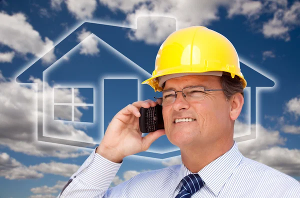Contractor in Hardhat on His Cell Phone Stock Photo