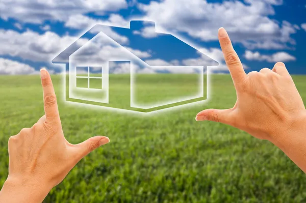 Hands Framing House Over Grass Field — Stock Photo, Image