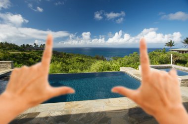 Hands Framing Pool and Hot Tub Overlooking View clipart