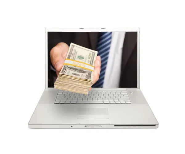 Hombre entregando pila de dinero a través de la pantalla —  Fotos de Stock