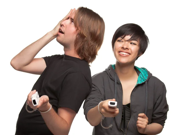 Casal diversificado com controladores de jogos de vídeo se divertindo isolado em branco — Fotografia de Stock