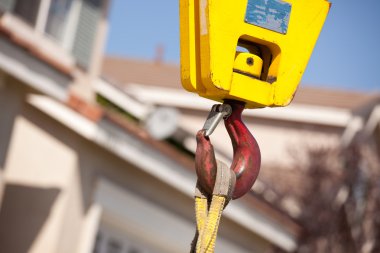 Yellow Utility Industrial Crane Head with Red Hook. clipart