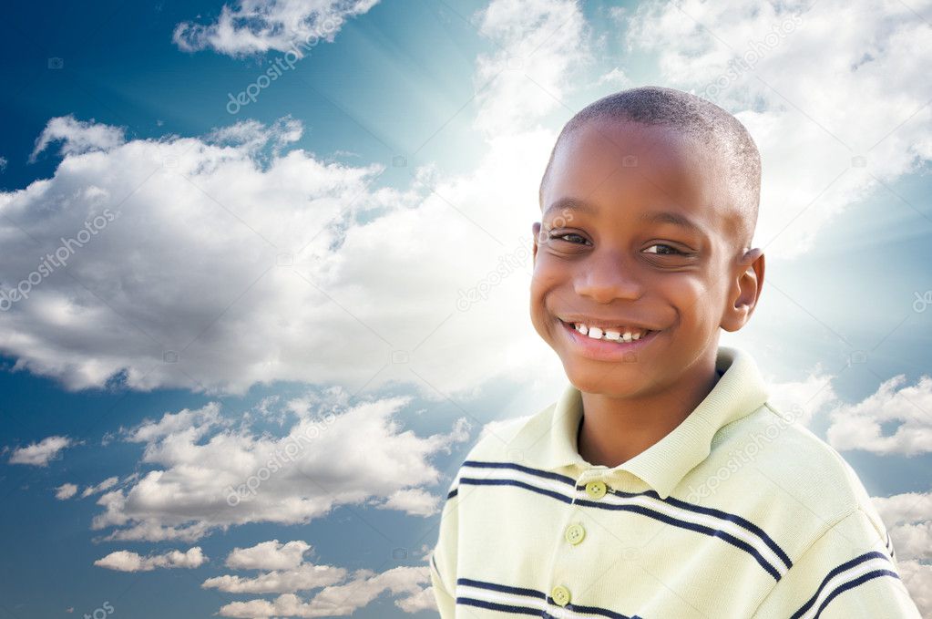 Young African American Boy with Clouds and Sky