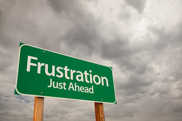 Frustration Green Road Sign Over Storm Clouds — Stock Photo, Image