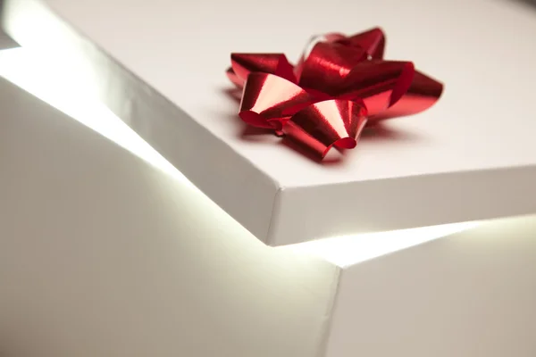 Red Bow Gift Box Lid Showing Very Bright Contents — Stock Photo, Image