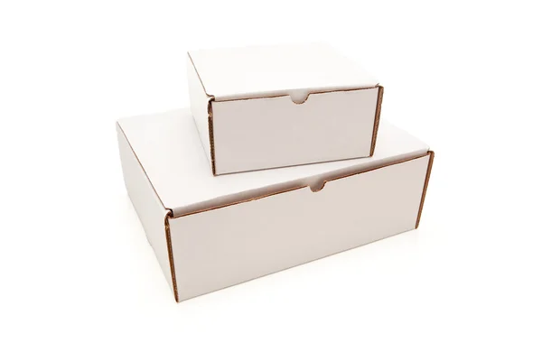 Pila de cajas de cartón blancas en blanco aislado — Stok fotoğraf