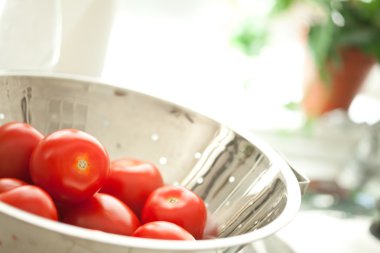 Fresh, Vibrant Roma Tomatoes in Colander with Water Drops clipart