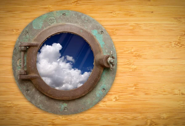 Antique Porthole on Bamboo Wall with View of Blue Sky and Clouds — Stock Photo, Image