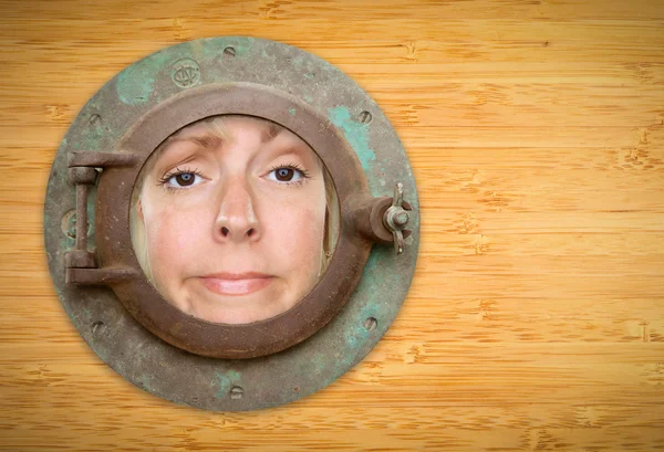 Antique Porthole on Bamboo Wall with Funky Woman Looking Through — Stock Photo, Image