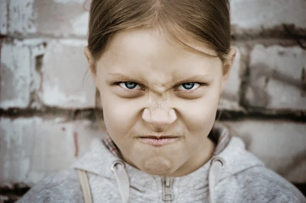 Closeup portrait of angry little girl — Stock Photo, Image