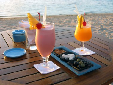 Cocktail by the beach in Mauritius clipart