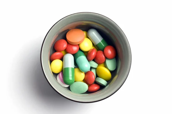 Moniväriset tabletit ja kapselit — kuvapankkivalokuva
