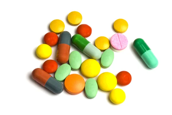 Barevné pilulky izolované na bílém — Stock fotografie