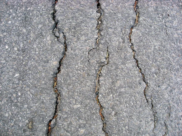 Pęknięcia na tle asfaltu — Zdjęcie stockowe