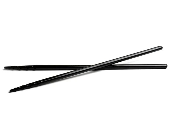 白で隔離される黒い箸 — ストック写真