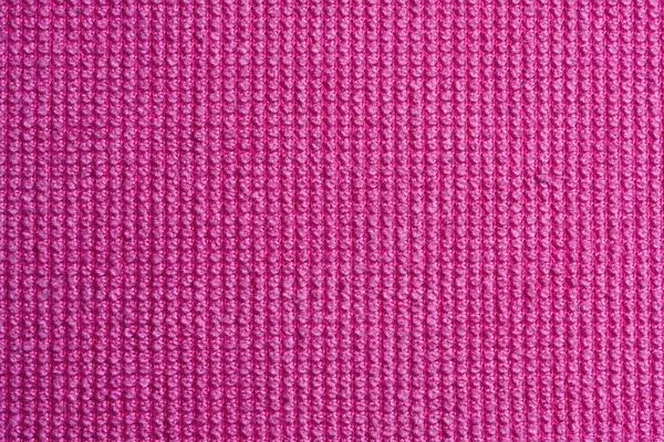 ピンク色の生地の背景のテクスチャ — ストック写真