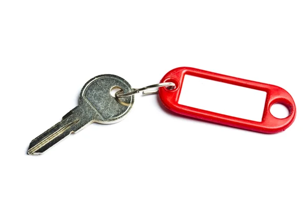 Boş etiket ve üzerinde beyaz izole bir anahtar — Stok fotoğraf