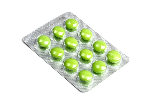 白で隔離される緑の薬のパッケージ — ストック写真