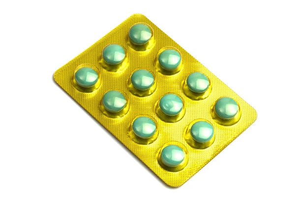 Pacote de pílulas verdes isoladas em branco — Fotografia de Stock