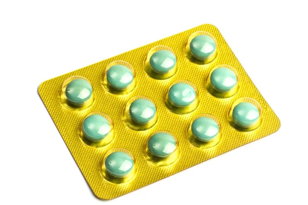Package of green pills isolated on white — Stock Photo, Image