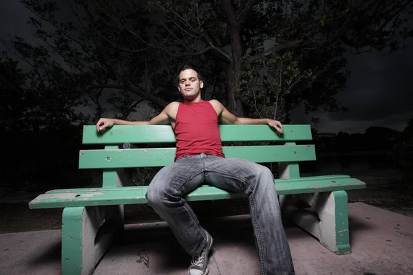 Man sitting on a bench — Stock Photo, Image