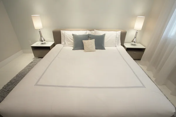 Modern bed shot at wide angle — Stock Photo, Image