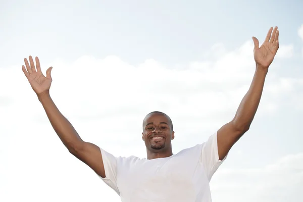 Black man with arms outstretched — Stock Photo, Image
