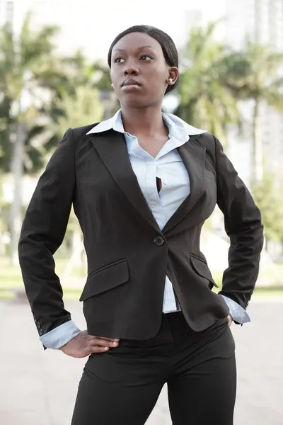 Businesswoman posing akimbo — Stock Photo, Image