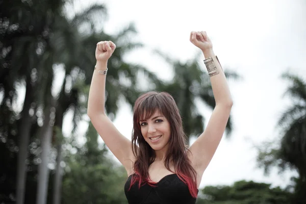 Happy woman with arms raised — Stock Photo, Image