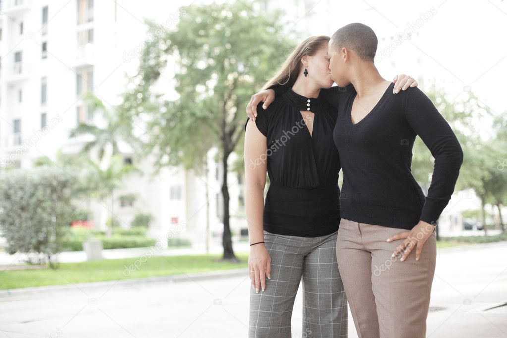 Businesswomen kissing