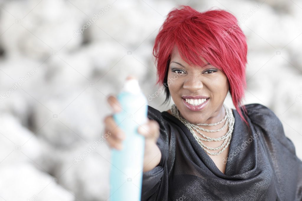 Woman spraying spray paint