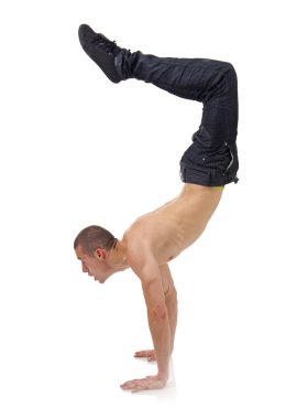 Young bboy standing on hands clipart