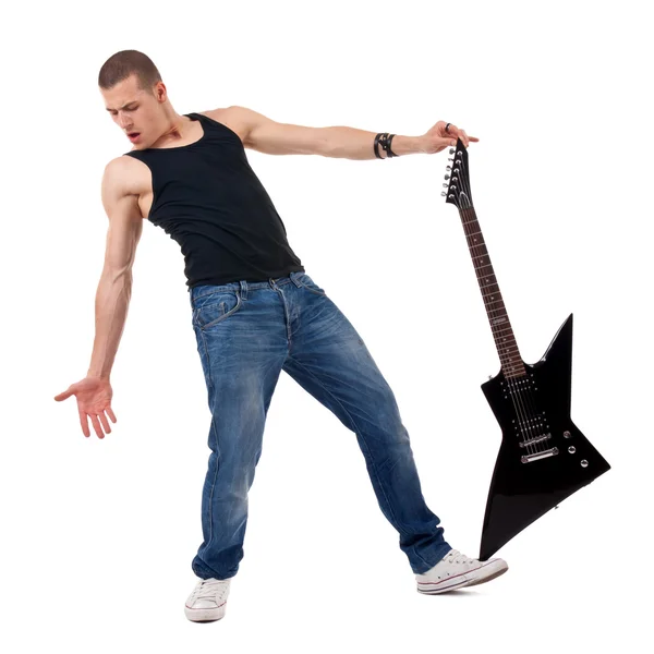 Holding guitar on foot — Stock Photo, Image